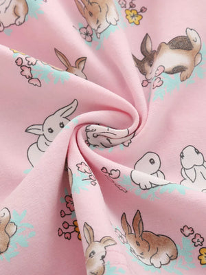 Pink cotton toddler dress with a cute bunny print and floral accents.