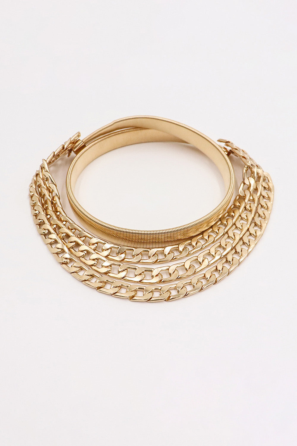 Gold chain belt with elastic band and multiple layered curb chains.