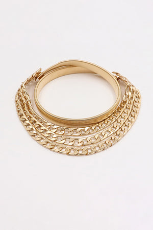 Gold chain belt with elastic band and multiple layered curb chains.