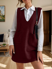 Burgundy knit sleeveless mini dress with v-neck and two front pockets.