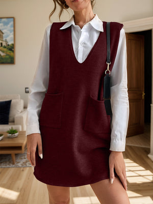 Burgundy knit sleeveless mini dress with v-neck and two front pockets.