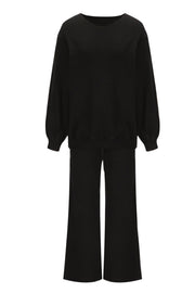 Black loungewear set with crewneck, balloon sleeves, and wide-leg pants.