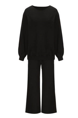Black loungewear set with crewneck, balloon sleeves, and wide-leg pants.