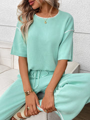 Light green knit loungewear set with crew neck top and drawstring pants.