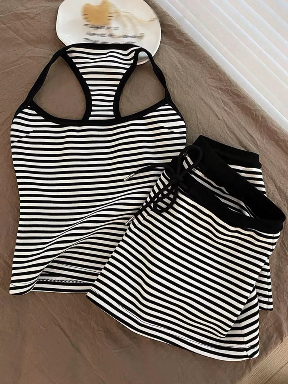 Black and white striped tank top and shorts set with drawstring waist.