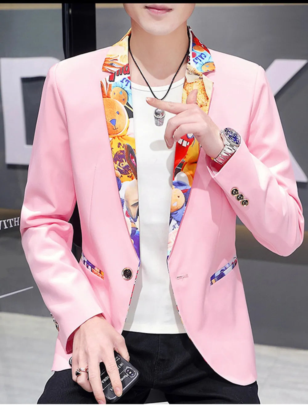 Pink slim fit blazer with vibrant cartoon print lapel and pocket trim.