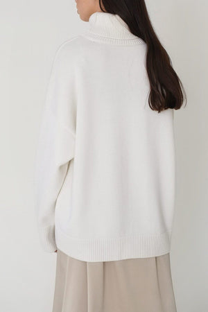 White relaxed roll-neck sweater with a boxy knit and ribbed cuffs and hem.