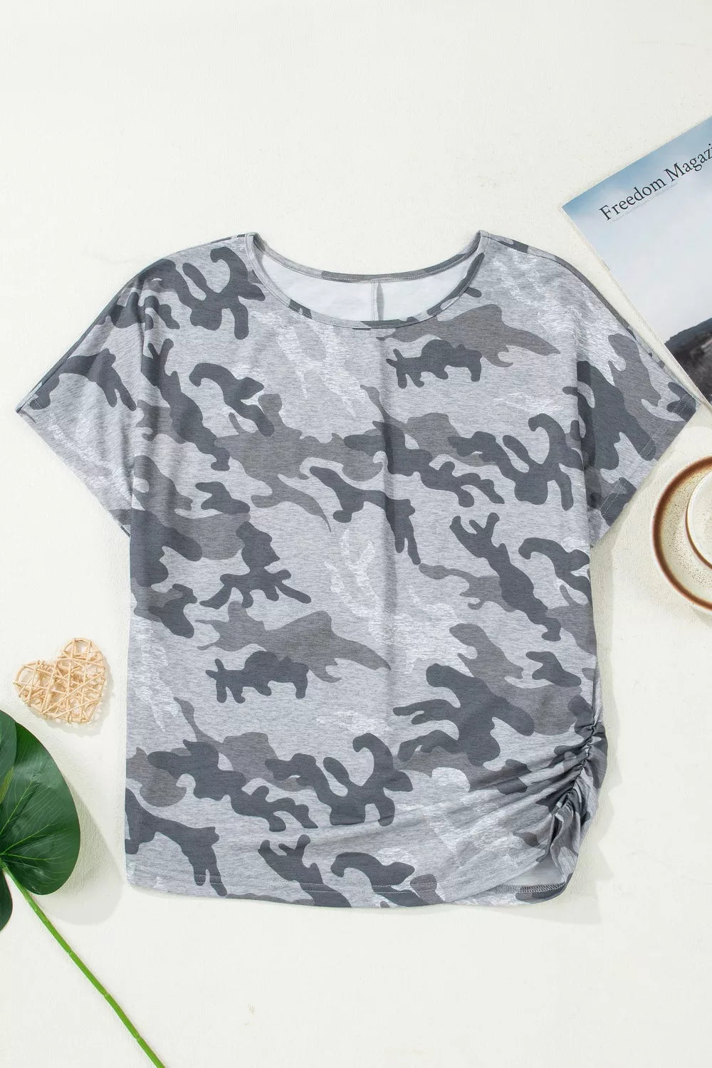 Grey camo print t-shirt with crew neck, short sleeves, and ruched side detail.