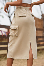 Tan midi skirt with drawstring waist, cargo pockets, and side slit.