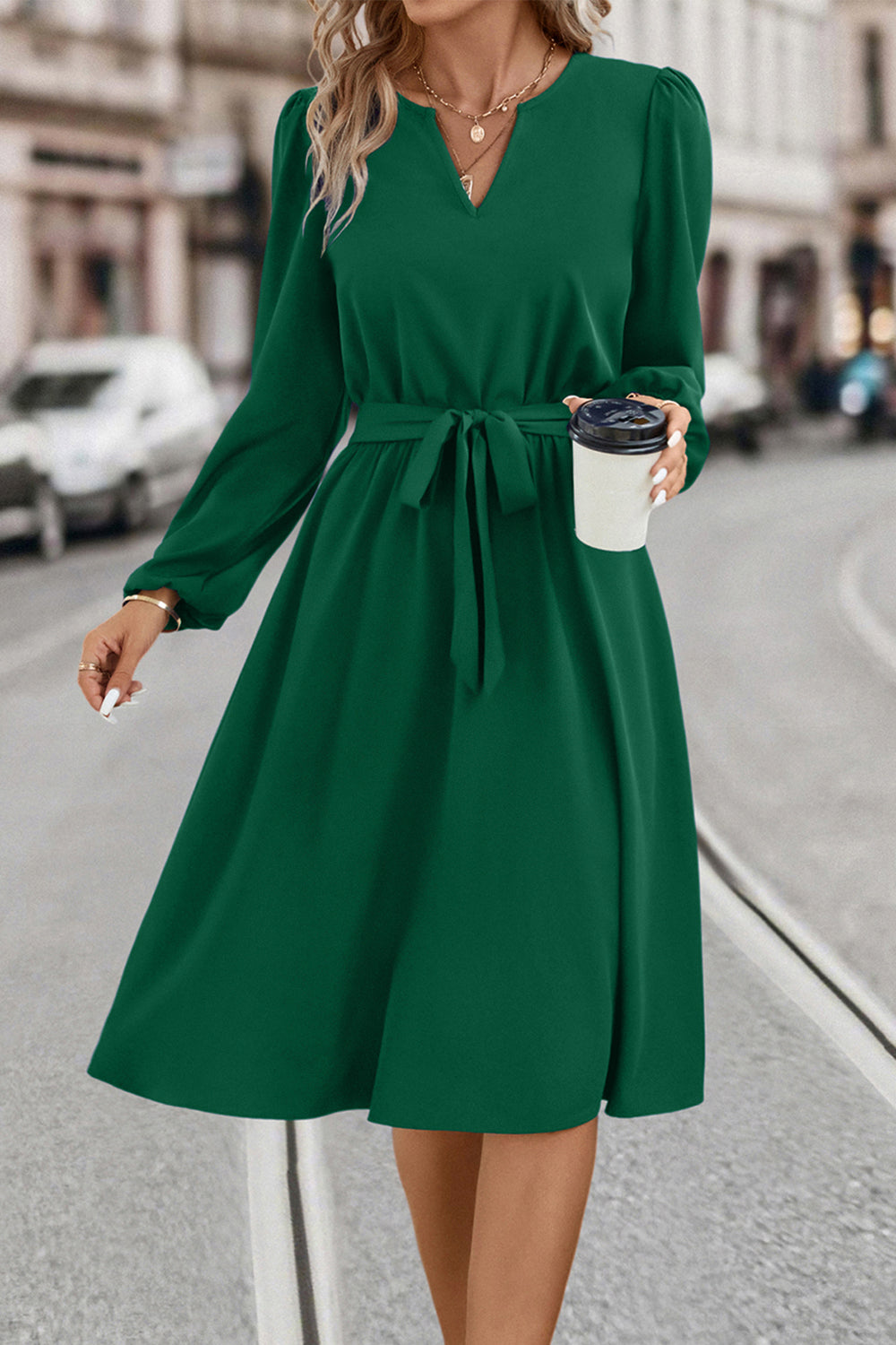 Emerald green midi dress with V-neck, poet sleeves, and tie waist