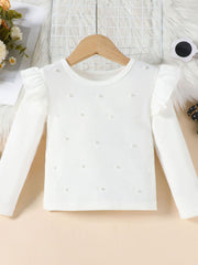 White ribbed long sleeve top with pearl details and ruffled shoulders