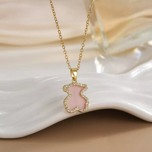 Gold-plated necklace with blush pink bear pendant outlined in crystals