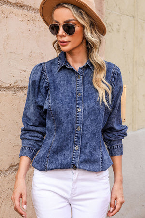 Acid wash denim shirt with puff sleeves and button front.