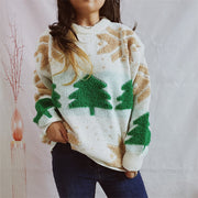 Cream knit sweater with green Christmas tree appliqués and tan snowflake pattern.