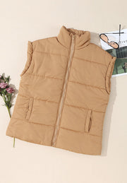 Tan padded sleeveless hooded vest with zip front and two front pockets.