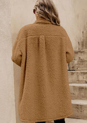 Sherpa coat in beige with a collared neckline and button-down front, shown from the back.