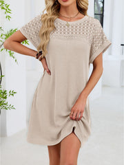 Beige t-shirt dress with sheer lace yoke and short sleeves.
