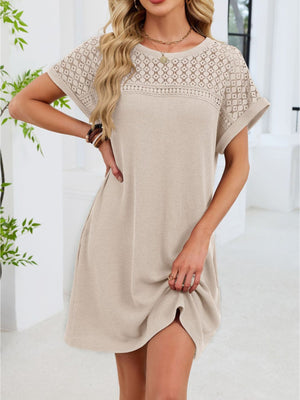 Beige t-shirt dress with sheer lace yoke and short sleeves.