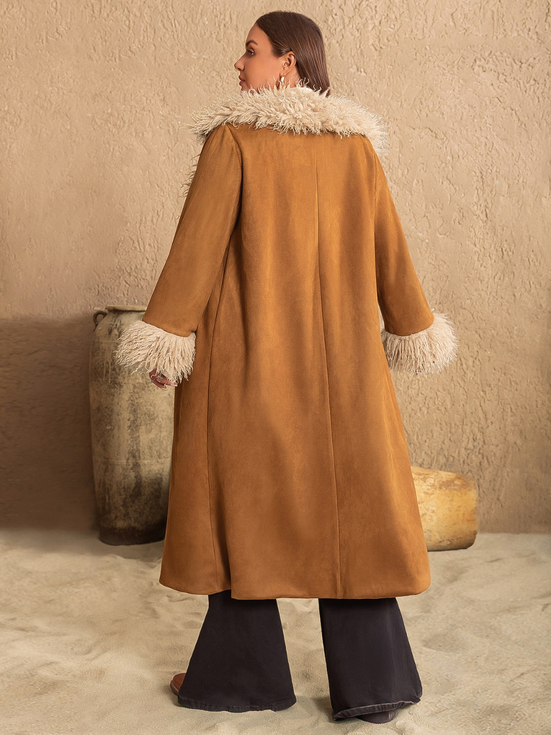 Caramel duster coat with faux fur trim on collar and cuffs, long sleeves, open front.