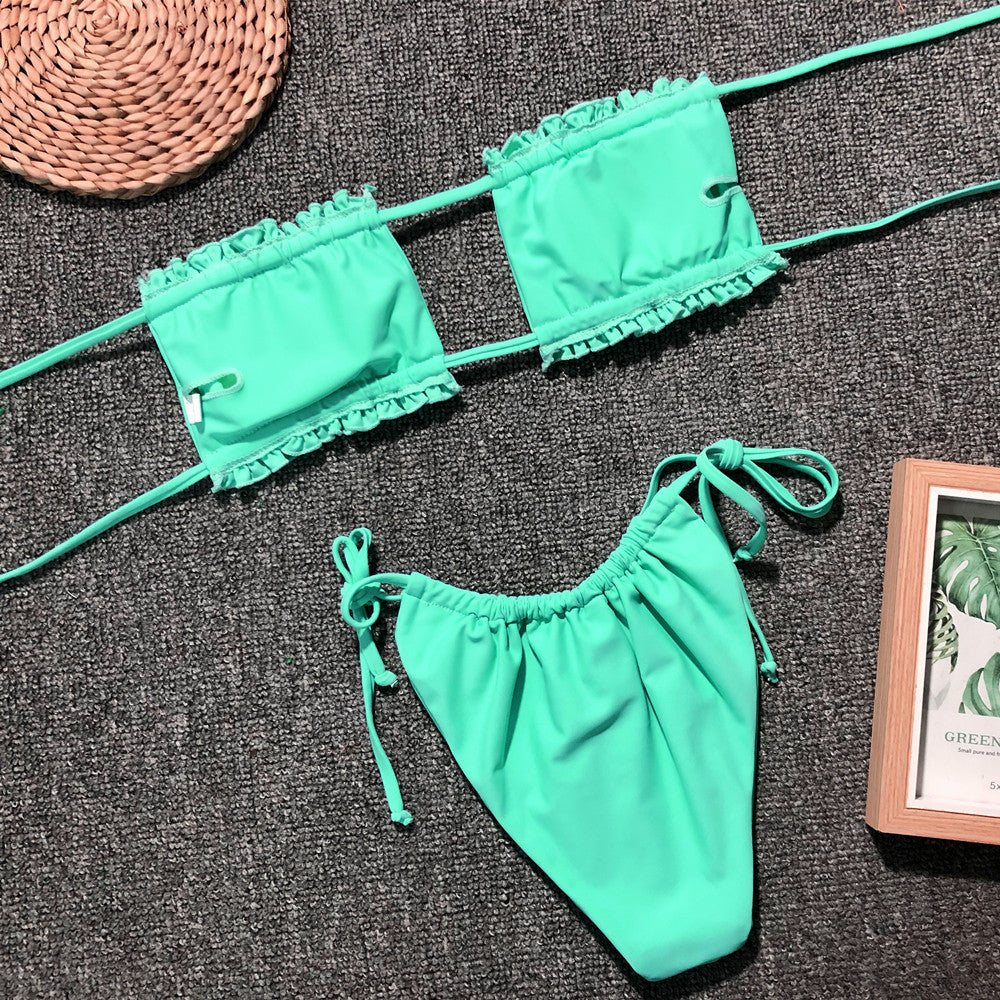Neon green ruffled bandeau bikini set with tie-side bottoms.