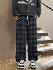 Men's dark gray plaid wide leg trousers with drawstring waist.