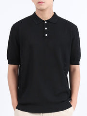 Black textured knit polo shirt with classic collar and short sleeves.