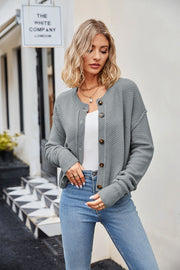 Textured knit cropped cardigan in Cloudy Blue with button front and crew neck.