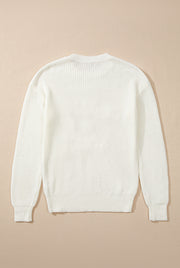 Ivory acrylic knit sweater with ribbed texture and crew neck.