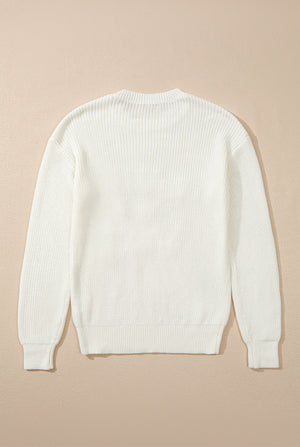 Ivory acrylic knit sweater with ribbed texture and crew neck.