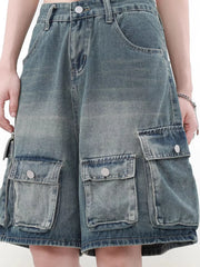 Men's blue denim cargo shorts with multiple pockets and a faded wash.