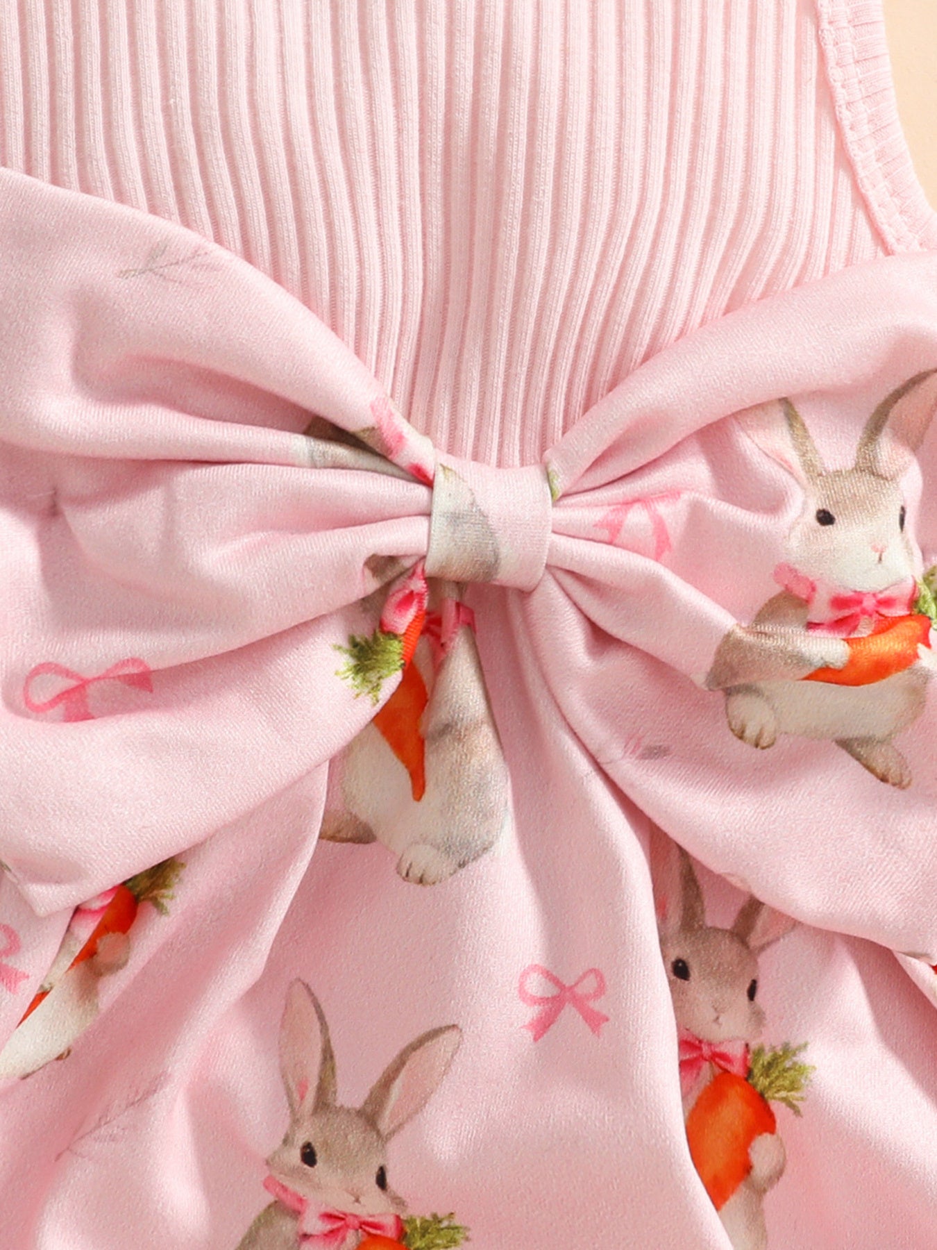Pink baby set with ruffled texture and bunny and carrot print.