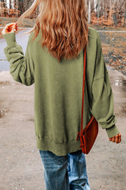 Oversized washed cotton sweatshirt in Sage with side slits and crew neck.