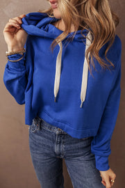 Cobalt cropped hoodie with contrast ties and a relaxed fit.