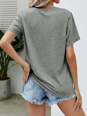 Mid Gray t-shirt with short sleeves and a relaxed fit, styled with denim shorts.