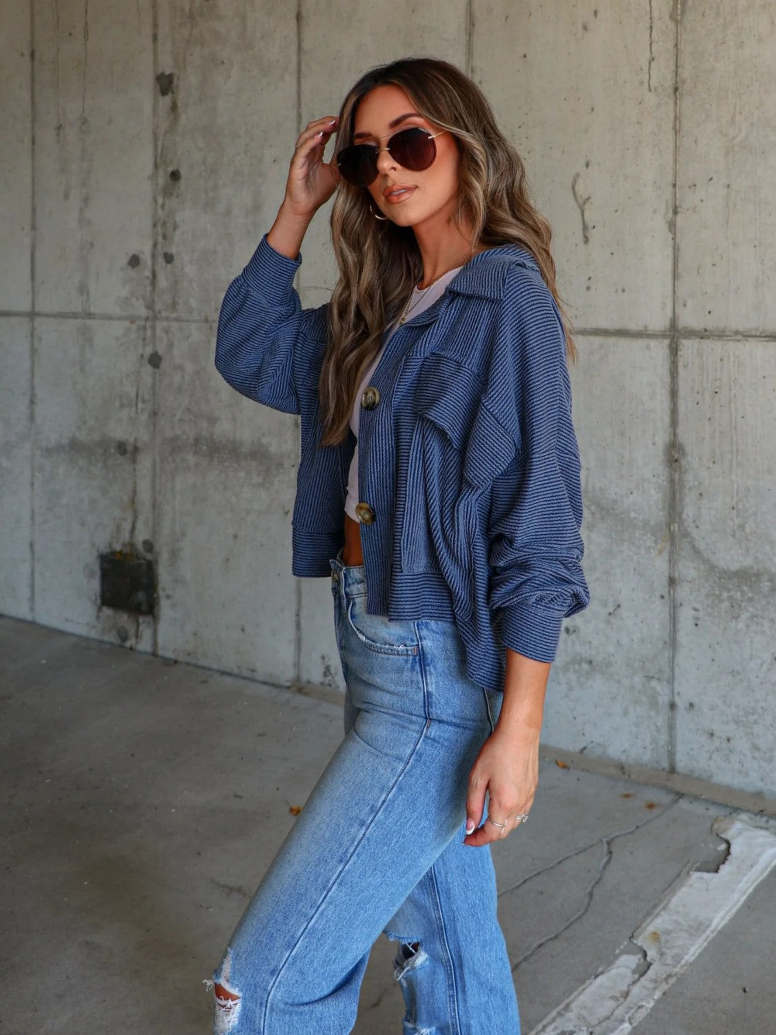 Peacock blue textured utility shirt jacket with button front and chest pockets.