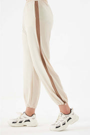Relaxed trousers in camel with a contrasting side stripe detail and elastic cuffs.