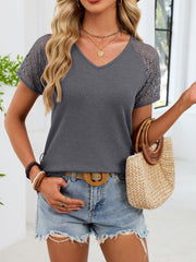 Gray waffle knit t-shirt with V-neck and lace short sleeves.