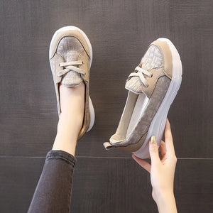 Beige mesh and leather platform slip-on flats with white soles.