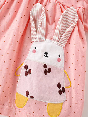 Pink cotton toddler bubble shorts set with brown polka dots and a bunny applique.