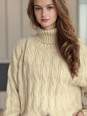 Oversized beige cable knit turtleneck pullover sweater with a ribbed collar.