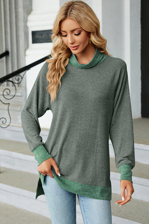 Colorblock raglan turtleneck tunic in heather gray with green accents at the collar, cuffs, and hem.