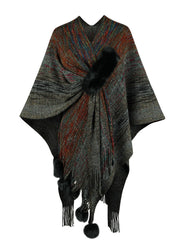 Knit wrap coat in charcoal with multicolor stripes, black fur trim, and pom-pom embellishments.