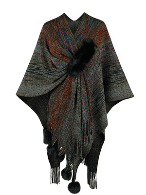 Knit wrap coat in charcoal with multicolor stripes, black fur trim, and pom-pom embellishments.