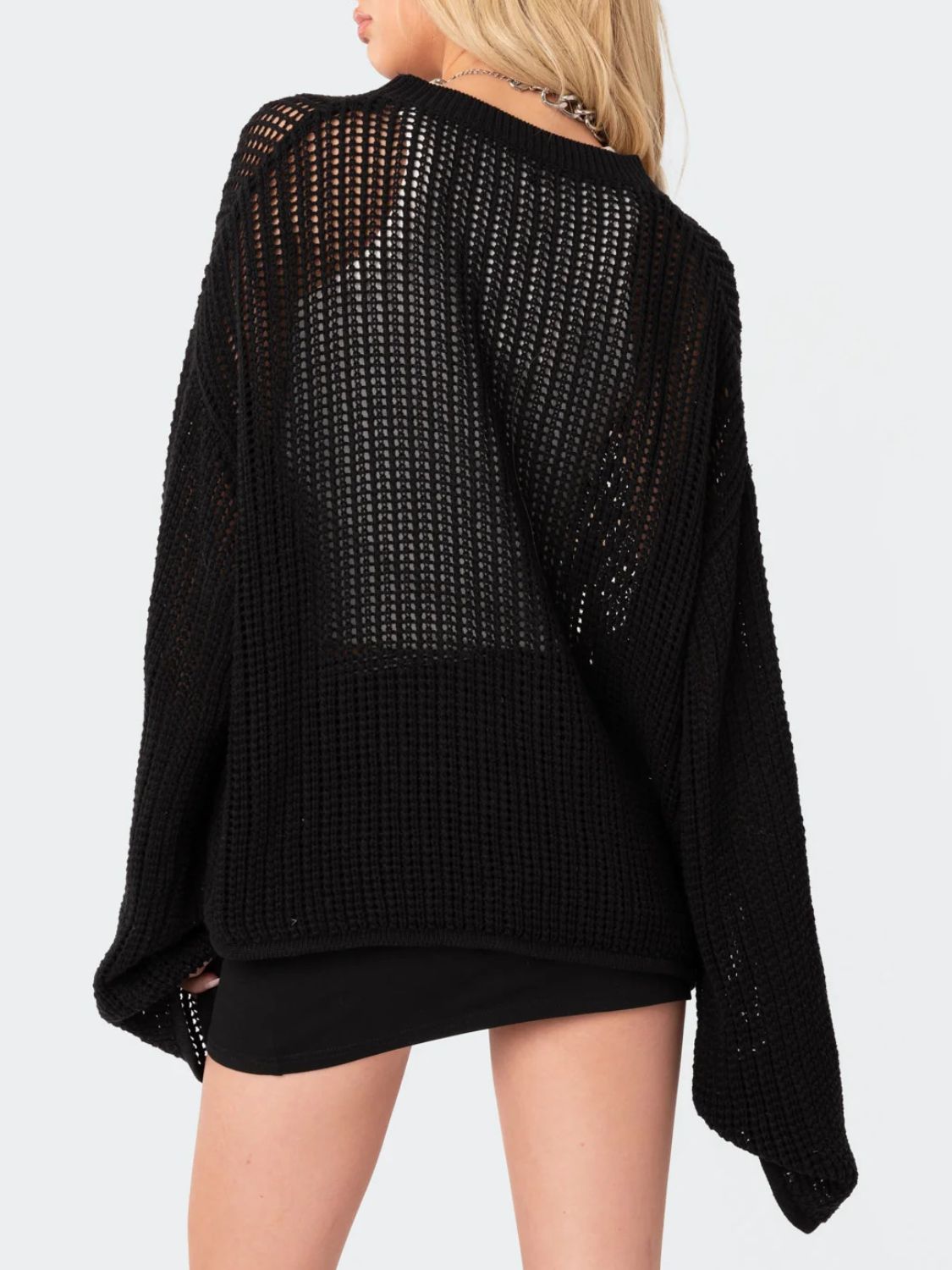 Black open knit acrylic sweater with a relaxed fit and crew neck.