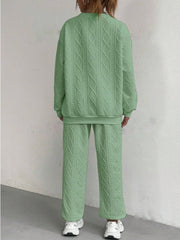 Cable knit lounge set in Gum Leaf green, featuring a crewneck sweatshirt and wide-leg pants.