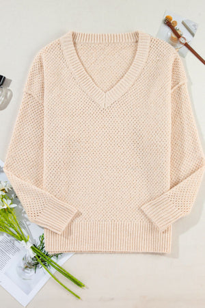 Beige open-knit V-neck sweater with ribbed cuffs and hem