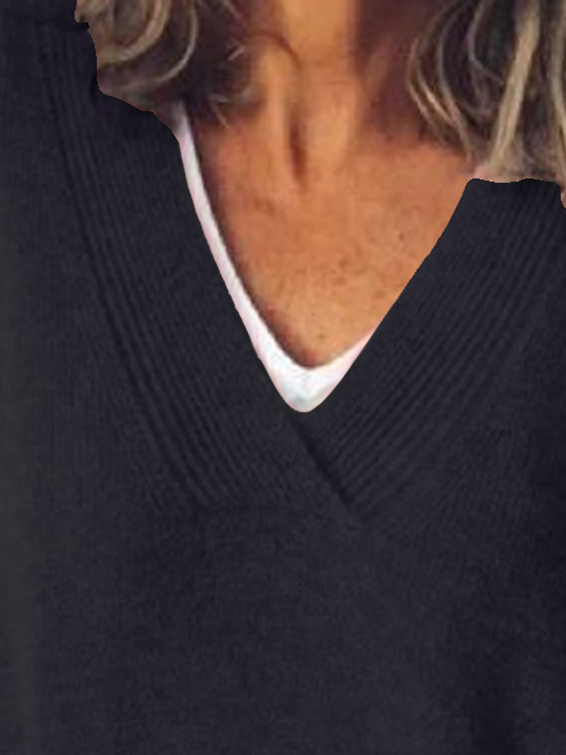 Black ribbed knit sweater with V-neck and white undershirt detail