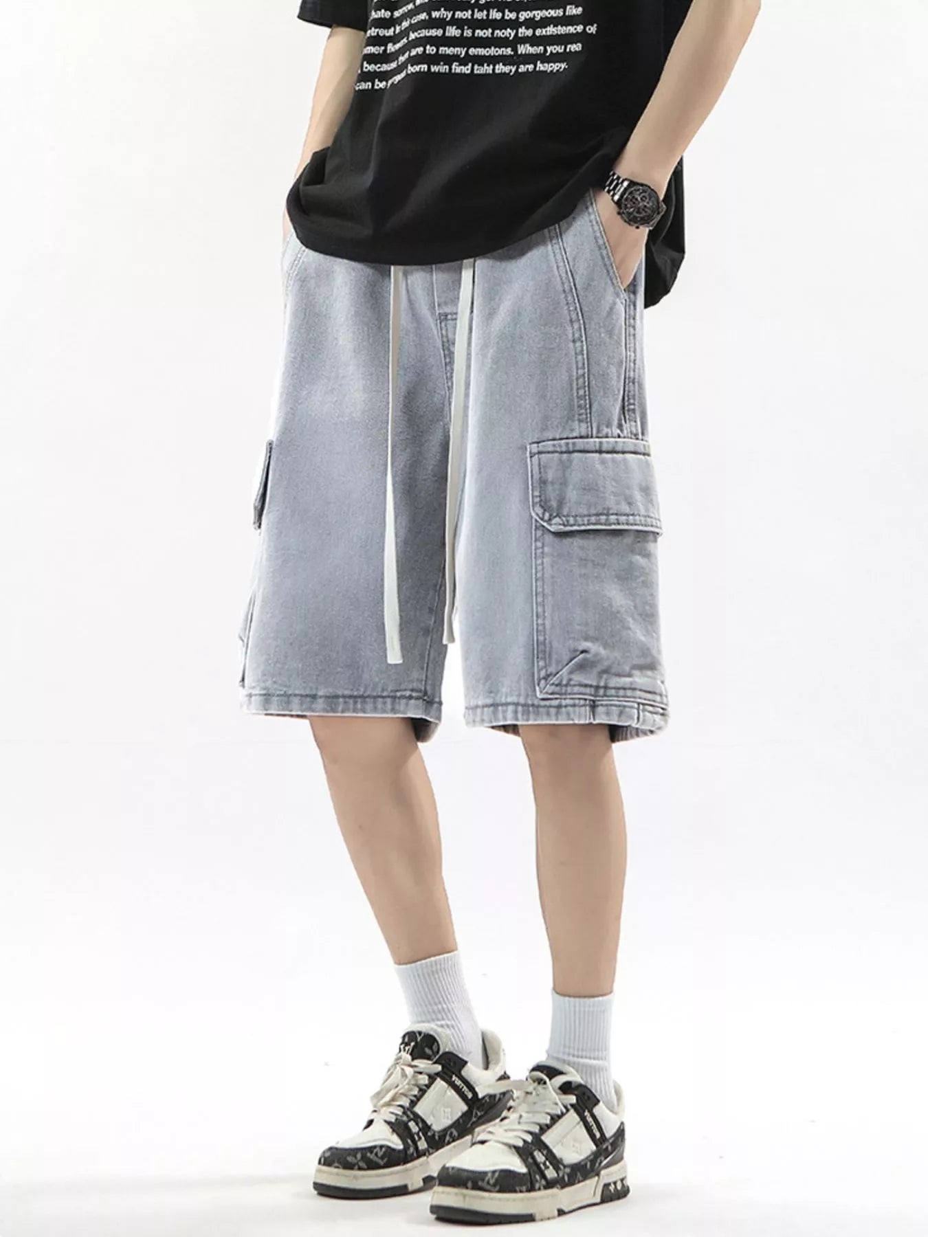 Men's light wash denim cargo shorts with drawstring and multiple pockets.