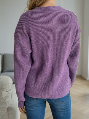 Textured ribbed knit oversized sweater in mauve with a relaxed fit.