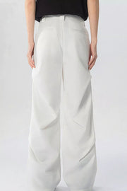 White wide-leg sweatpants with pockets and a relaxed fit.